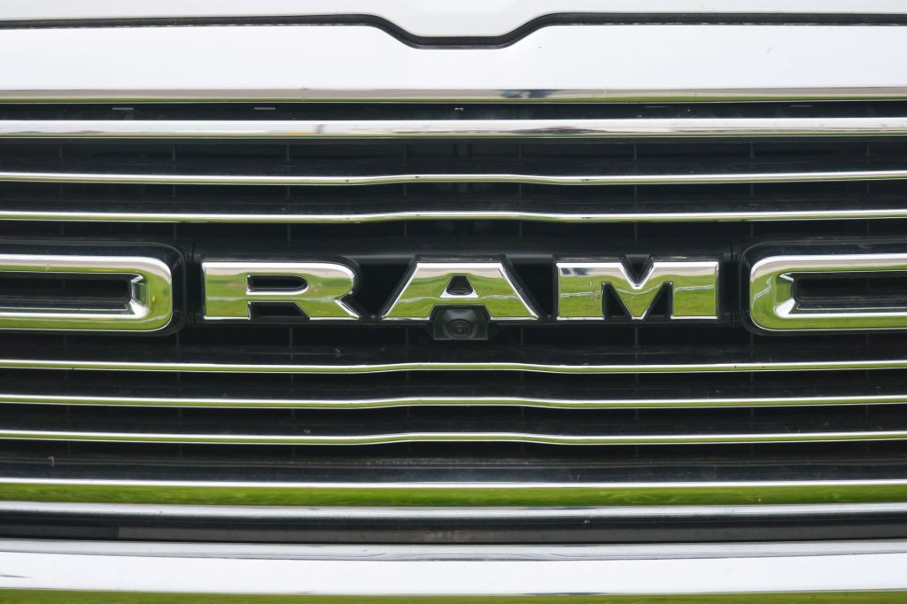 The grille of a Ram with "RAM" placed in the grille.