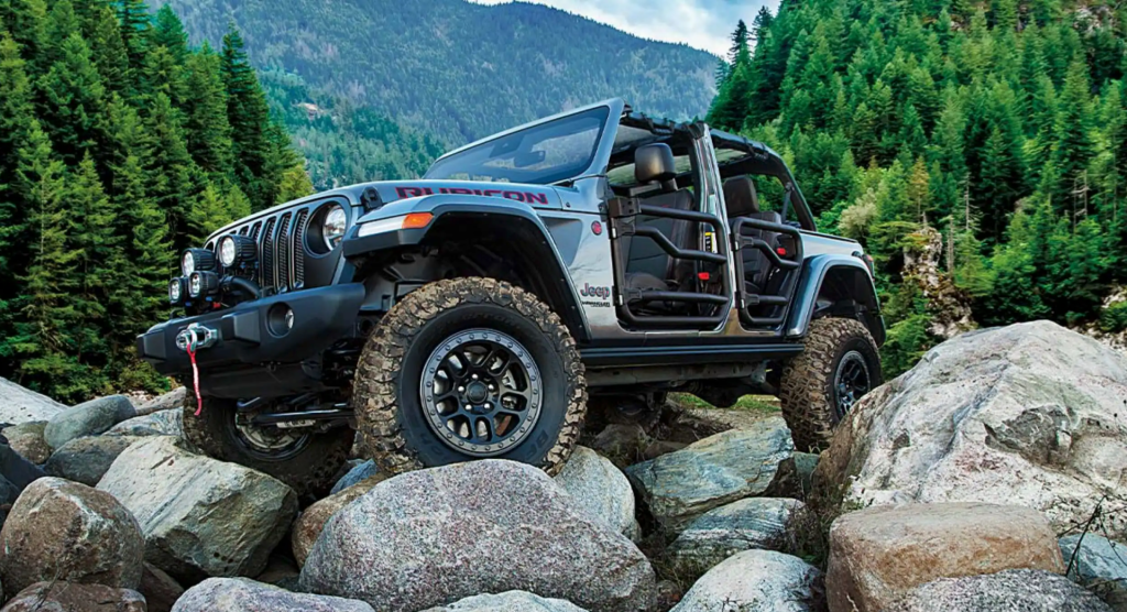 The 2021 Jeep Wrangler 4xe crawling over rocks