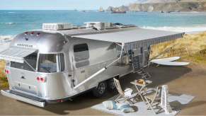 The Airstream Pottery Barn Travel Trailer parked near the beach