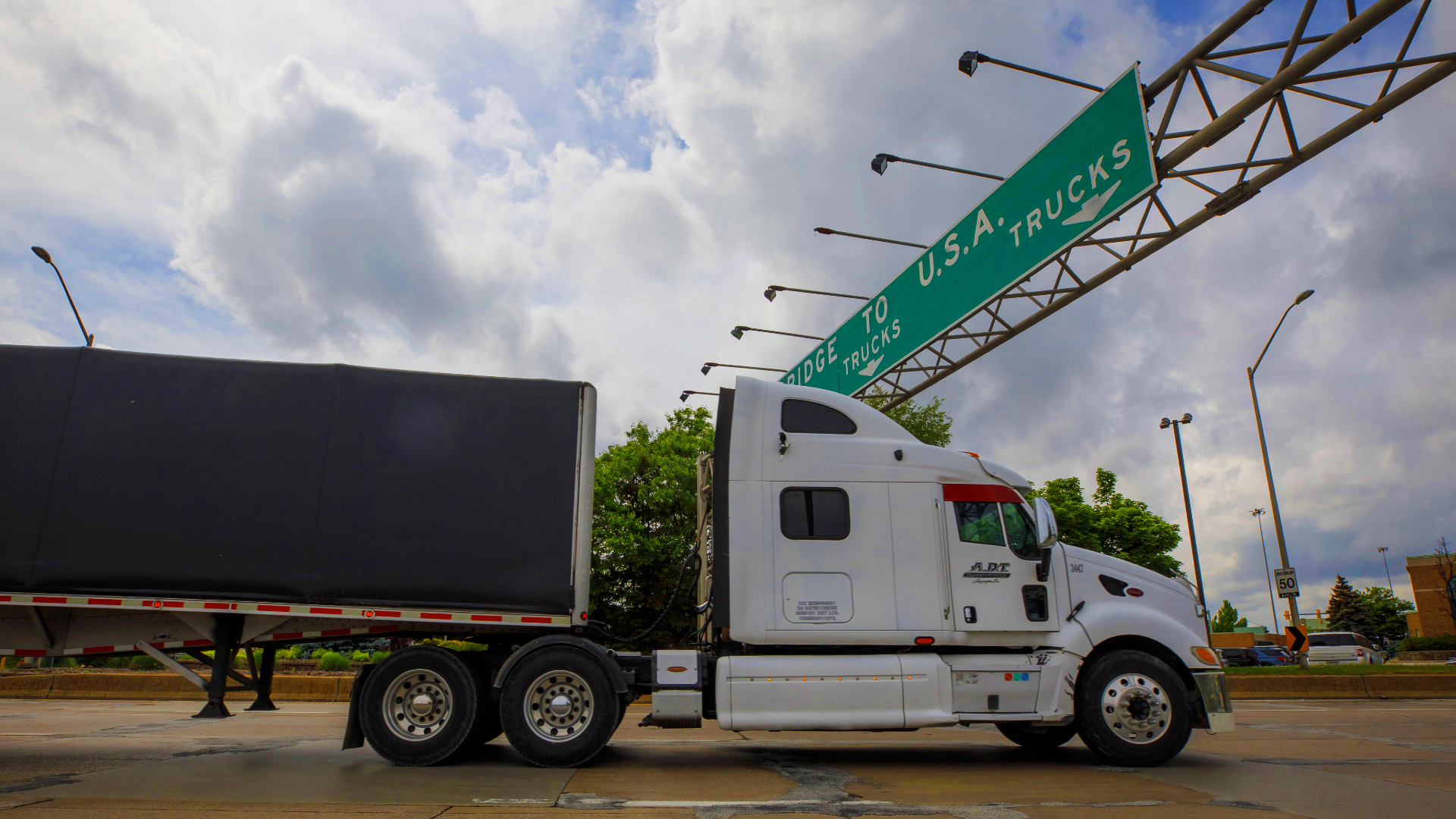A trucks enters a line to cross the Ambassador Bridge into Detroit, Michigan.