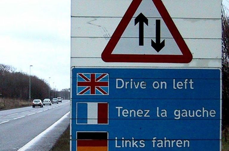 sign telling European drivers to drive on the left side of the road in the U.K. in case they have left-hand drive American cars