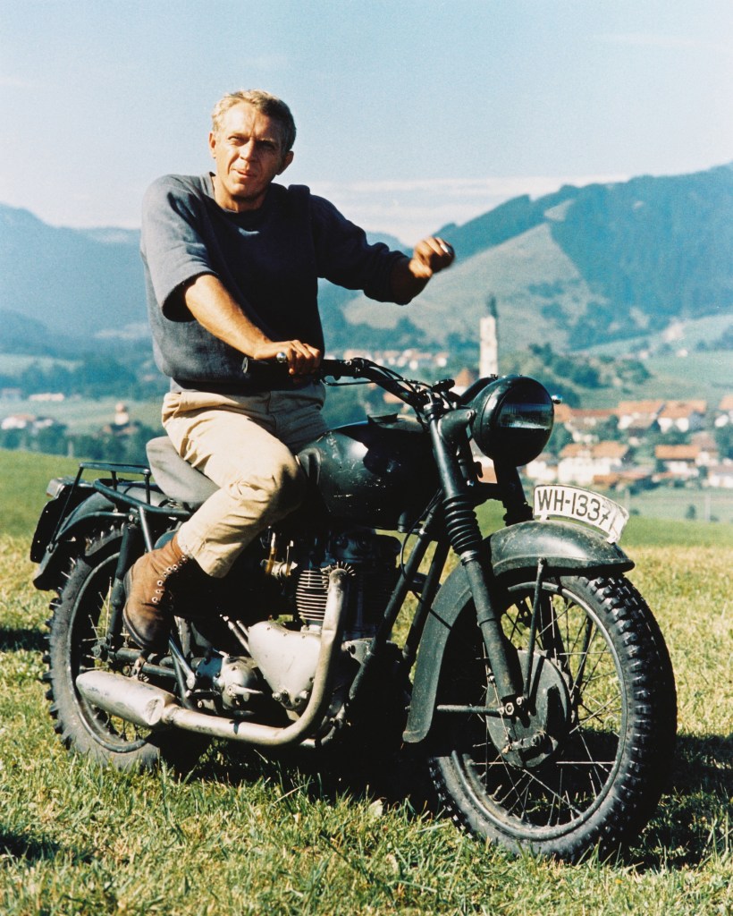 Steve McQueen riding a vintage Triumph