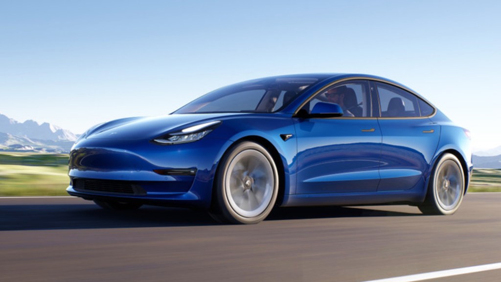 A blue Tesla Model 3 EV. 