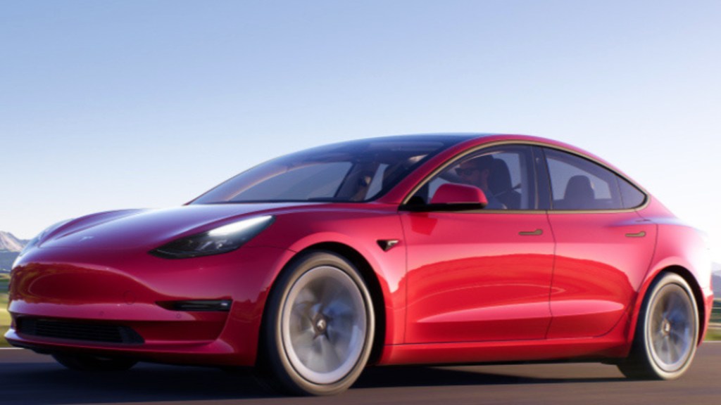 A red Tesla Model 3. 