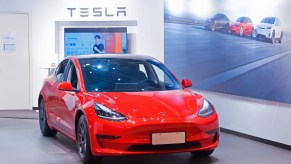 A red Tesla Model Y car at a Tesla sales store in downtown Shanghai, China, April 2, 2021.