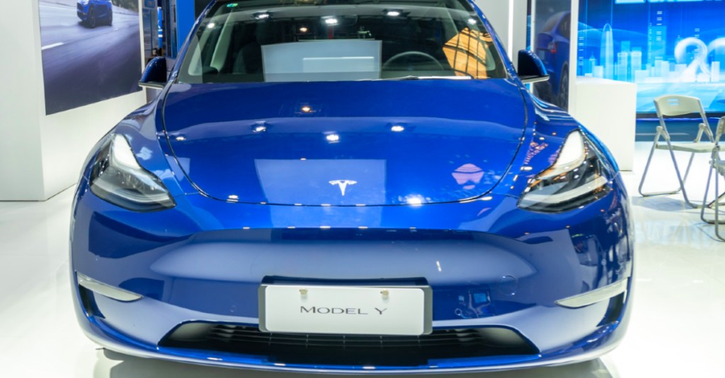 A blue Tesla Model Y electric SUV. 