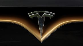 The Tesla logo on the front of a Model S vehicle
