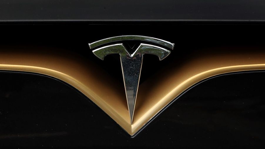 The Tesla logo on the front of a Model S vehicle