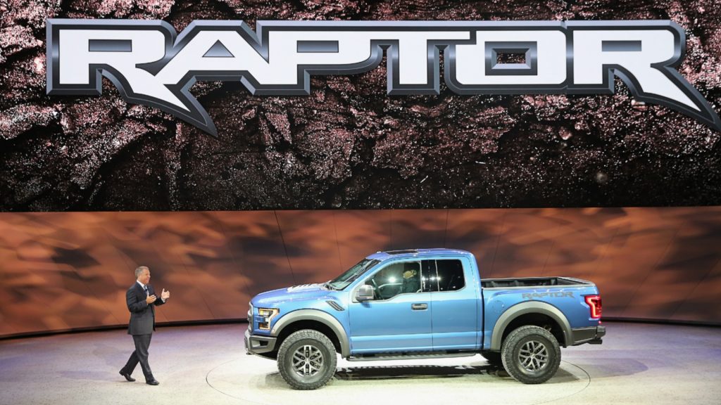 A blue Ford F-150 Raptor. 
