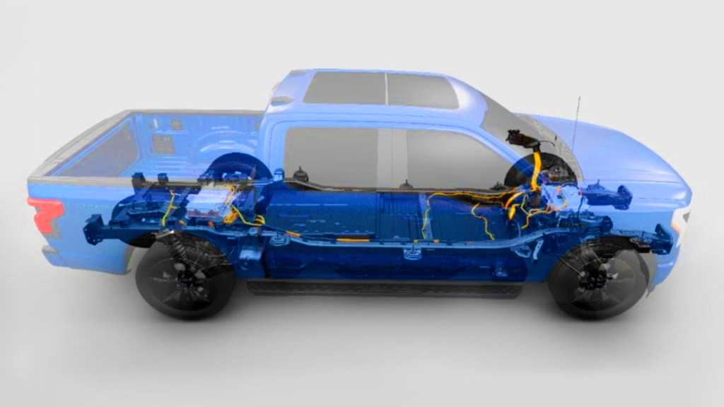 The powertrain of a blue Ford F-150 Lightning. 