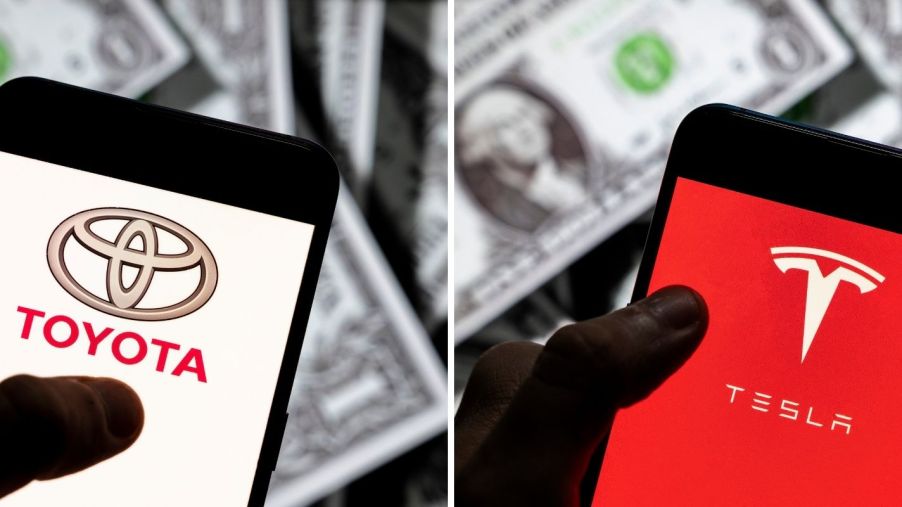 The Toyota and Tesla logos on smartphones with a background of dollar bills