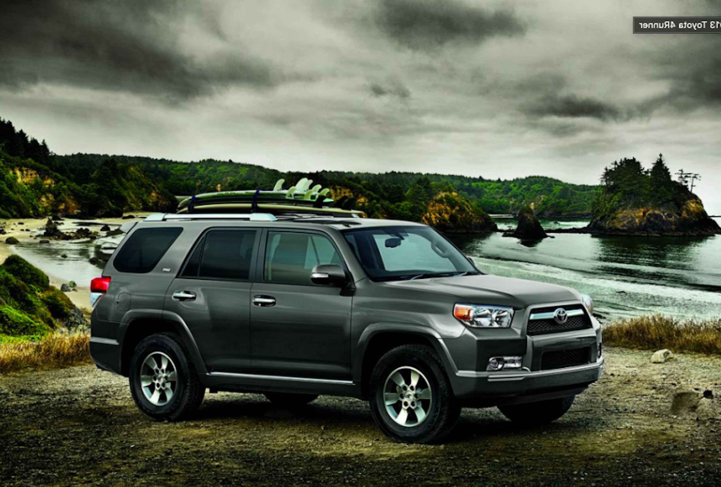 2013 Toyota 4Runner outside with surfboards on top