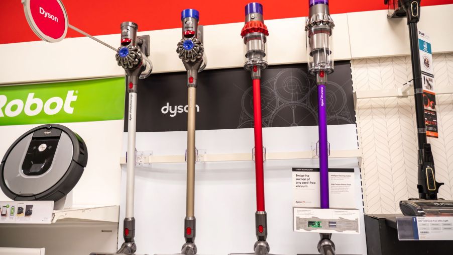 A row of vacuum cleaners in a store