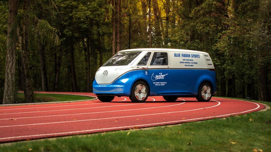 A Volkswagen ID. Buzz model with Nike and Blue Ribbon branding parked on a running track