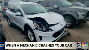 White wrecked Escape after "oil change."