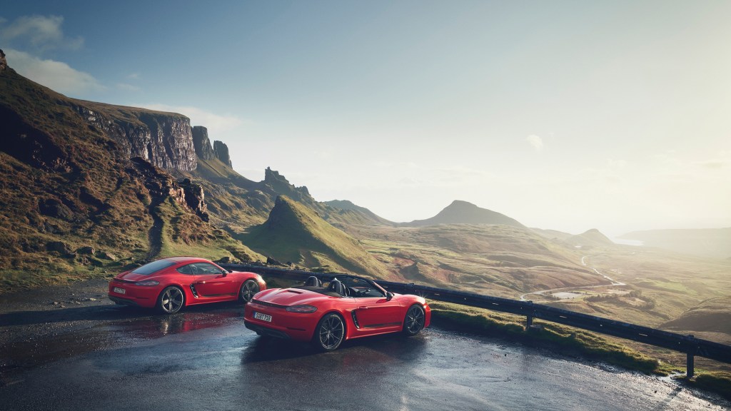 Stuttgart's red 718 Boxster and Cayman models looking out over a valley