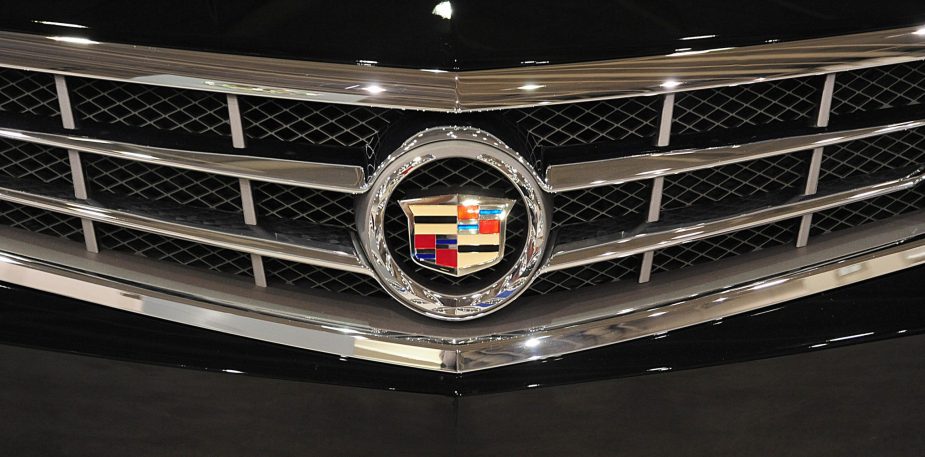 A Cadillac emblem on the grille of a luxury car