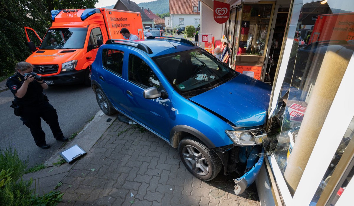 blue-car-crashed-into-storefront