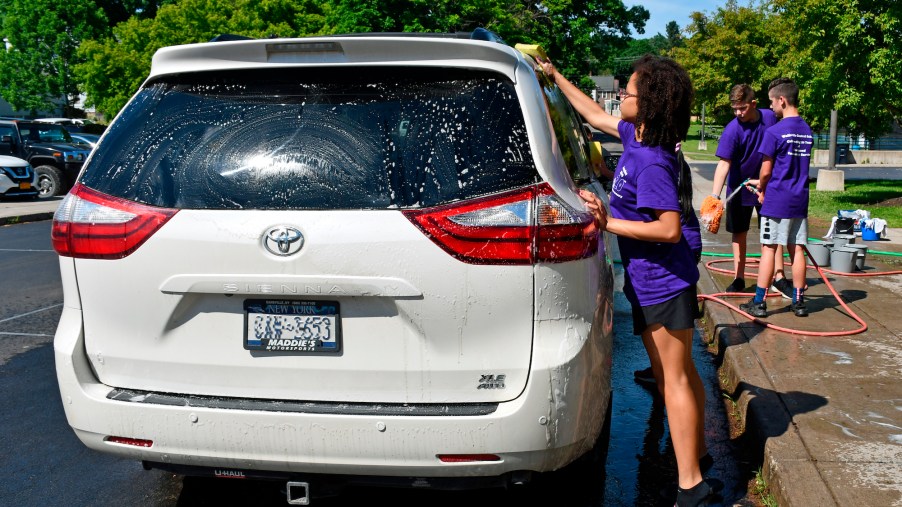 7th-graders wash a Toyota Sienna minivan for fundraiser in Wellsville, New York