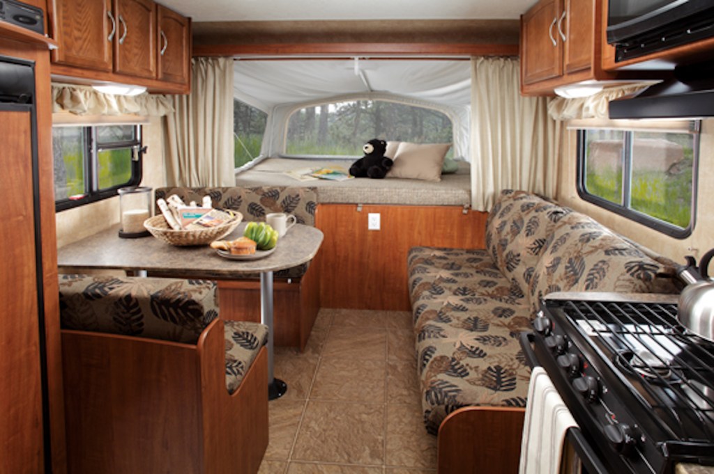 The interior living area inside of a 2011 Jayco Jay Feather Sport shows an example fo a used RV for under $5,000.