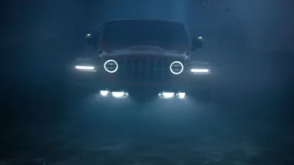 An image of a Jeep Wrangler underwater.