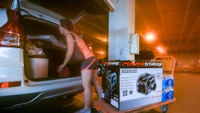 South Florida resident Andrea Kmetz buys a portable generator and bottled water in preparation for Hurricane Matthew on October 5, 2016, in Fort Lauderdale, Florida