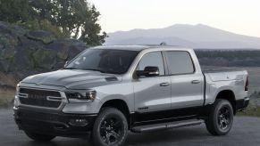 A grey 2022 Ram 1500 BackCountry Edition parked in front of a mountain view