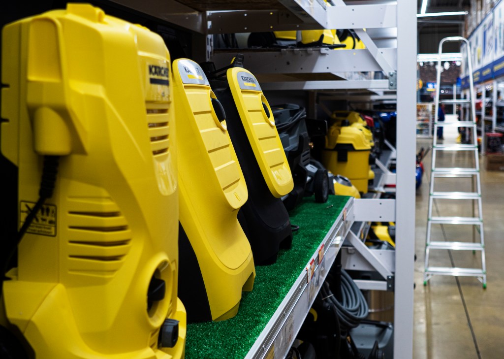 Yellow shop vacs on a shelf in a store