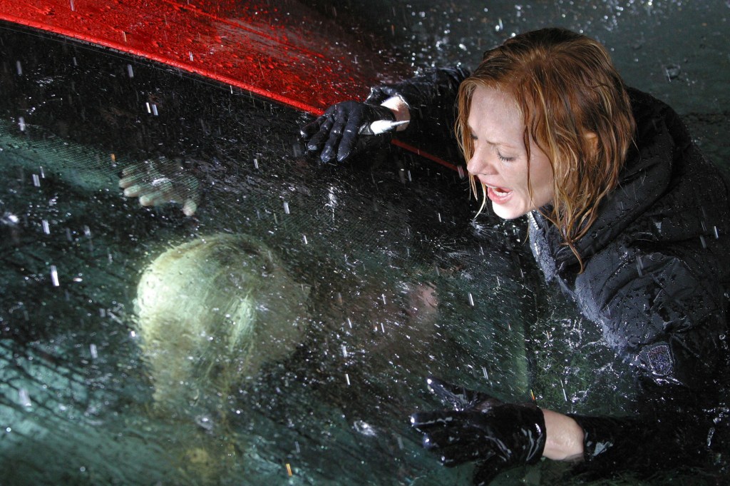 Catherine (Marg Helgenberger) attempts to rescue Lindsay (Madison McReynolds), trapped inside a sinking car on 'CSI'