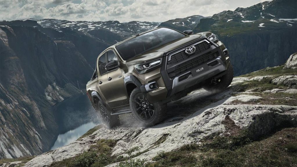 The 2020 Toyota Hilux climbing over rocks