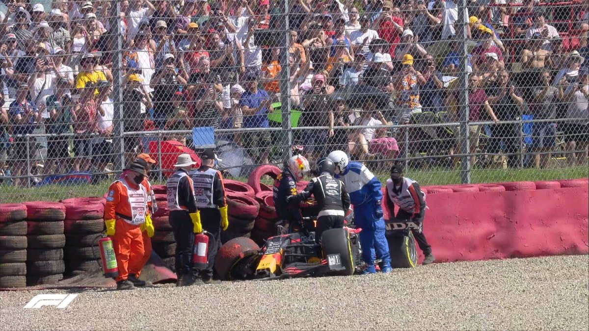 Max Verstappen climbing out of wrecked car at Silverstone 2021.