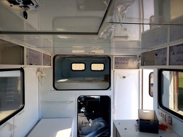 The interior of the modified Isuzu overland camper featuring several beds and safes