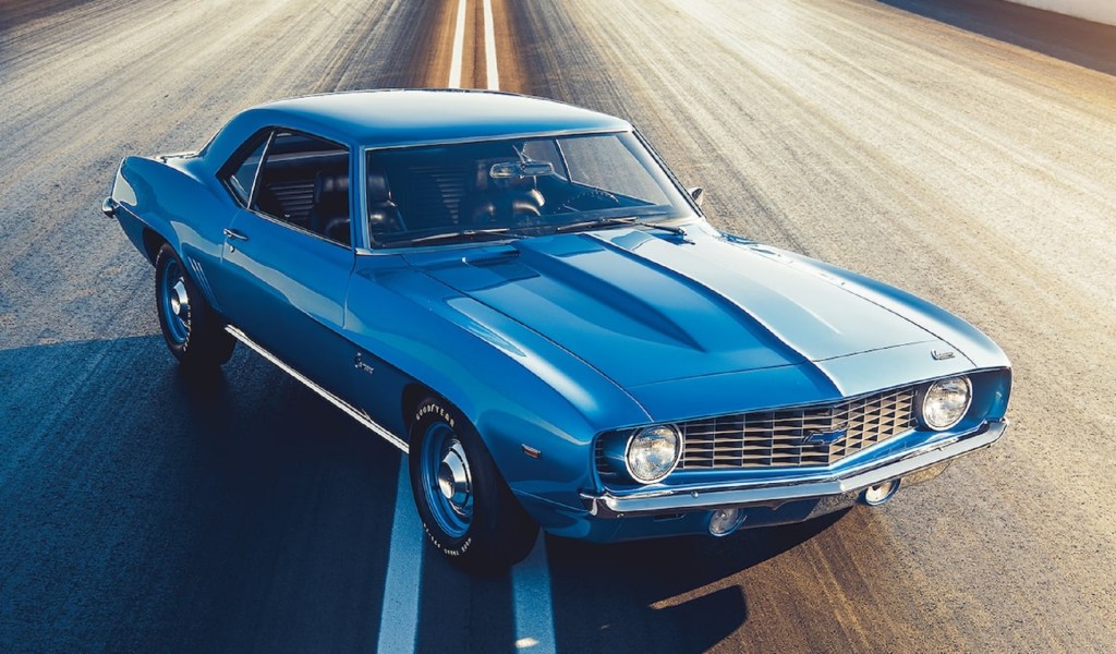 A blue 1969 Chevrolet COPO Camaro on a dragstrip