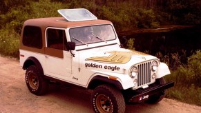 A 1979 Jeep CJ-7 Golden Eagle parked on a dirk road