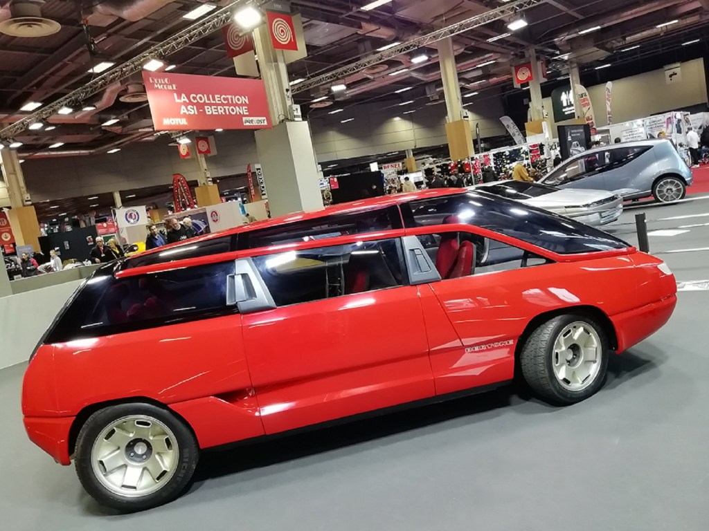 The side view of the red 1988 Bertone Genesis at Retromobile 2020