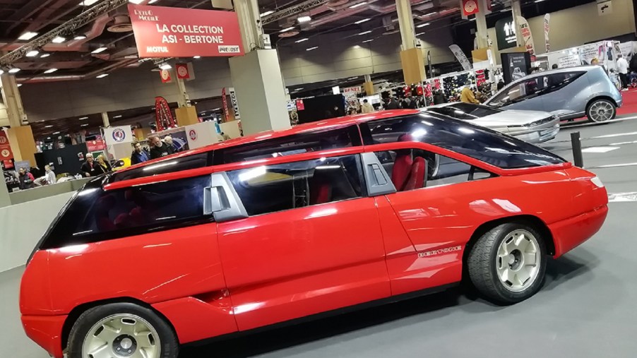 The side view of the red 1988 Bertone Genesis at Retromobile 2020