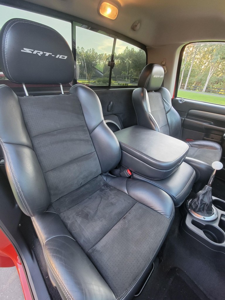 The black-leather sport seats and center console of a 2004 Dodge Ram SRT-10