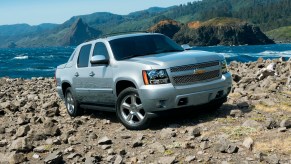 The 2012 Chevrolet Avalanche off-roading over rocks