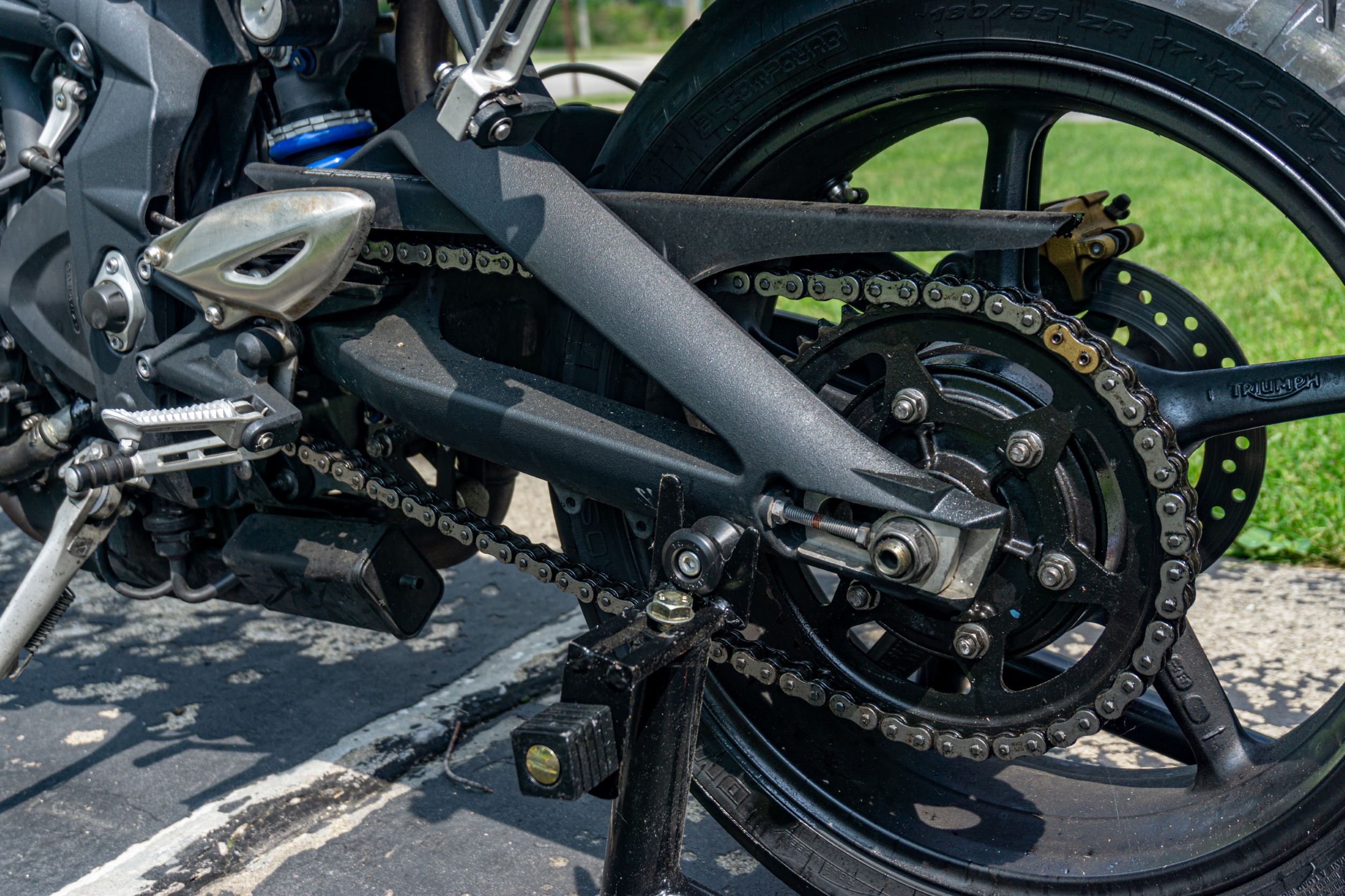 A 2012 Triumph Street Triple R with a dirty chain