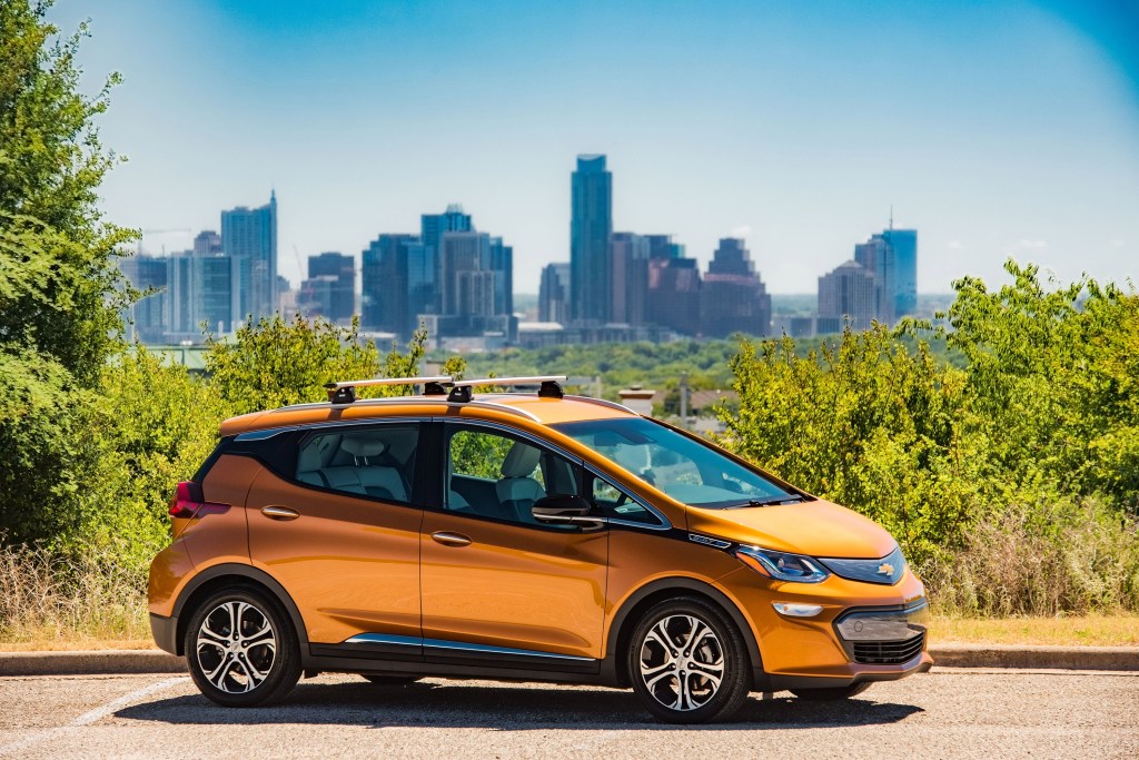 The Chevy Bolt EV hatchback with Austin, Texas in the background
