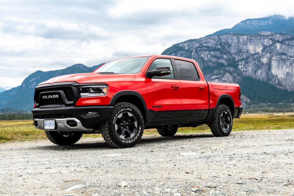 A red 2019 Ram 1500 parked in the mountains
