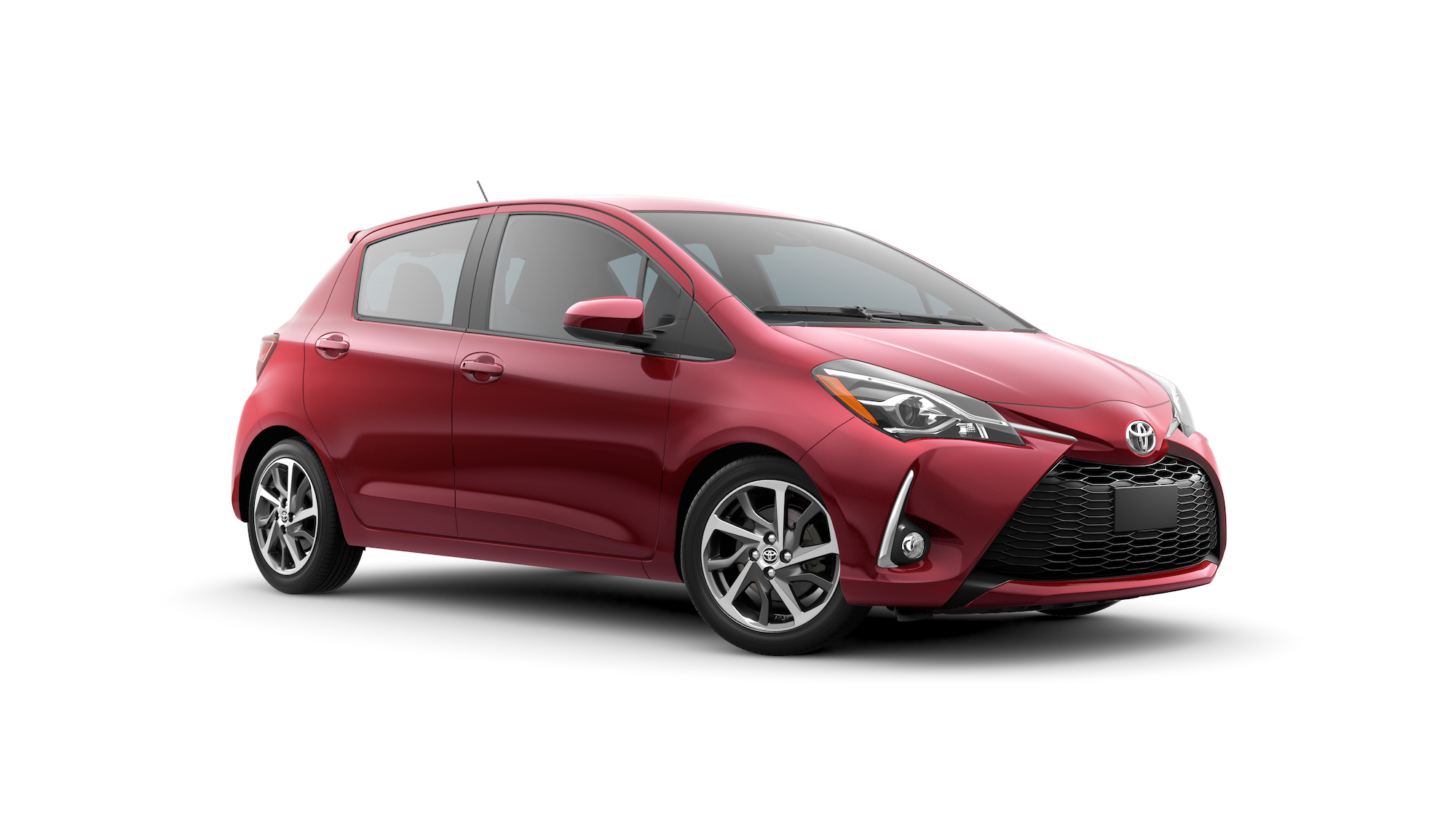A red 2020 Toyota Yaris SE hatchback on a white background