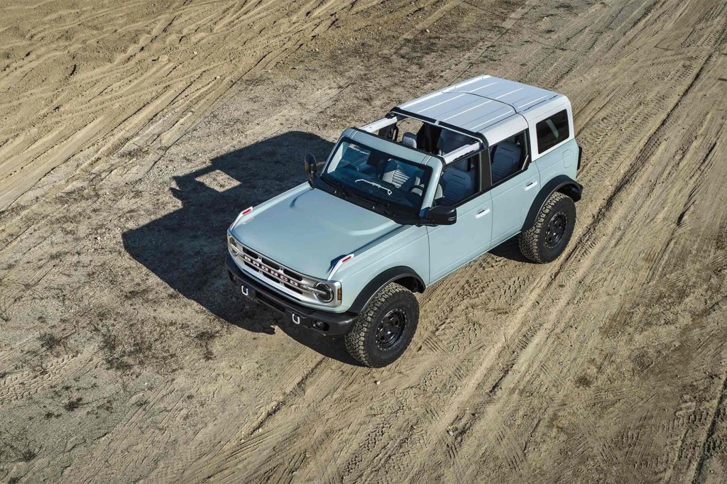 A powder-blue 2021 Ford Bronco SUV is shown from overhead with its roof partially removed