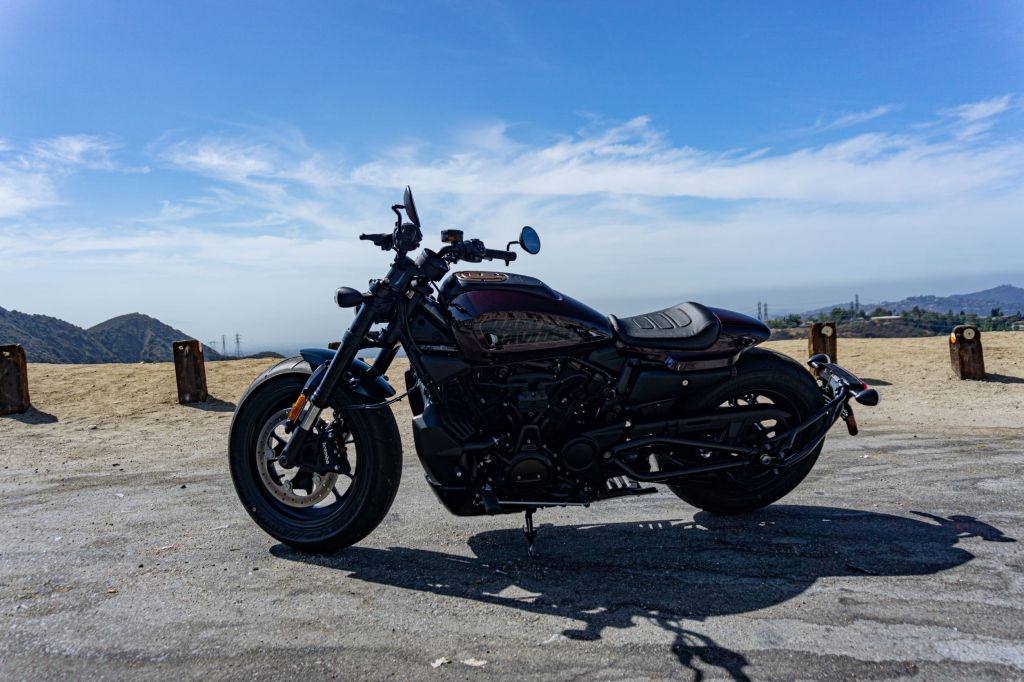 A maroon 2021 Harley-Davidson Sportster S parked on the side of an Angeles Crest Highway hill