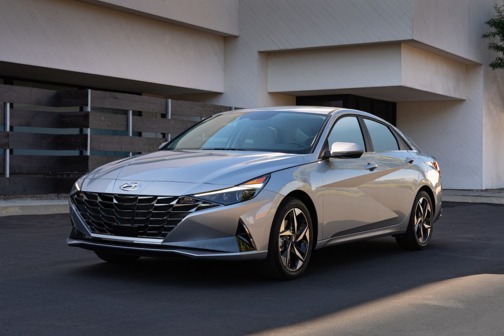 A silver 2021 Hyundai Elantra parked in a driveway, the 2021 Hyundai Elantra is one of the least reliable Hyundai models
