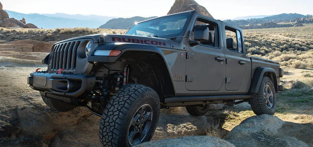 2021 Jeep Gladiator Rubicon crawling on rocks in the mountains 