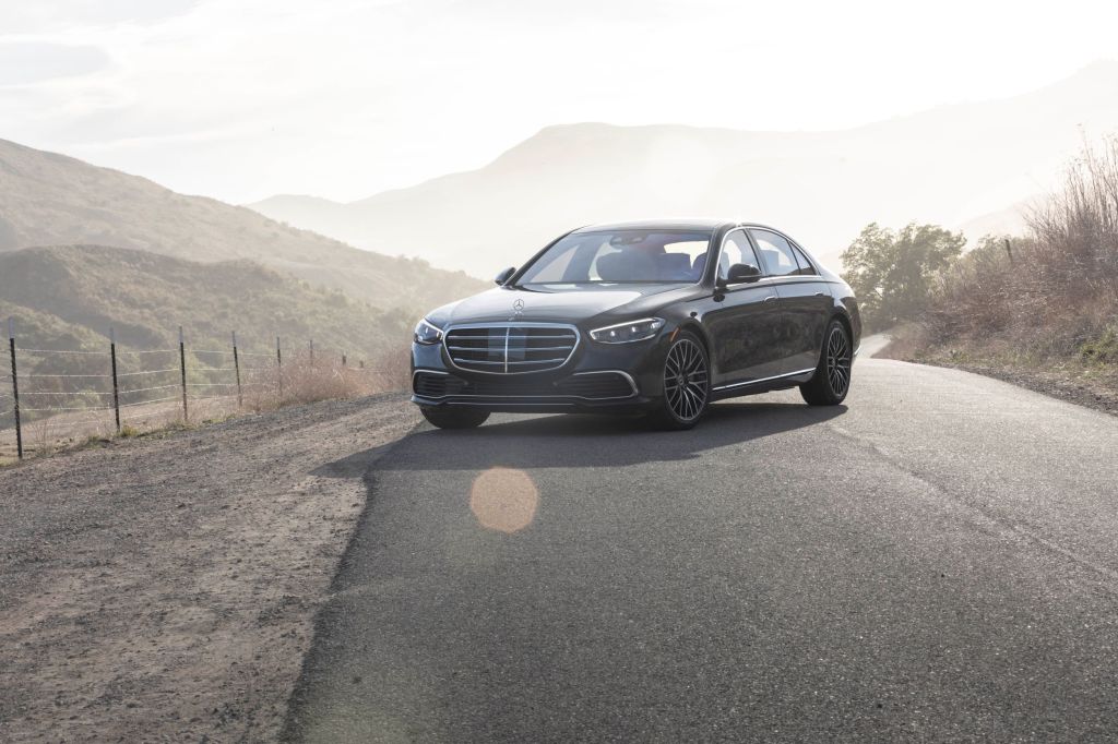 A black 2021 Mercedes-Benz S 580 4Matic S-Class on a mountain road