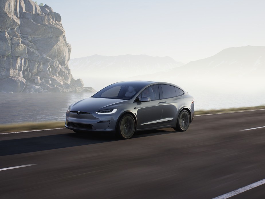 A 2021 Tesla Model X driving through fog