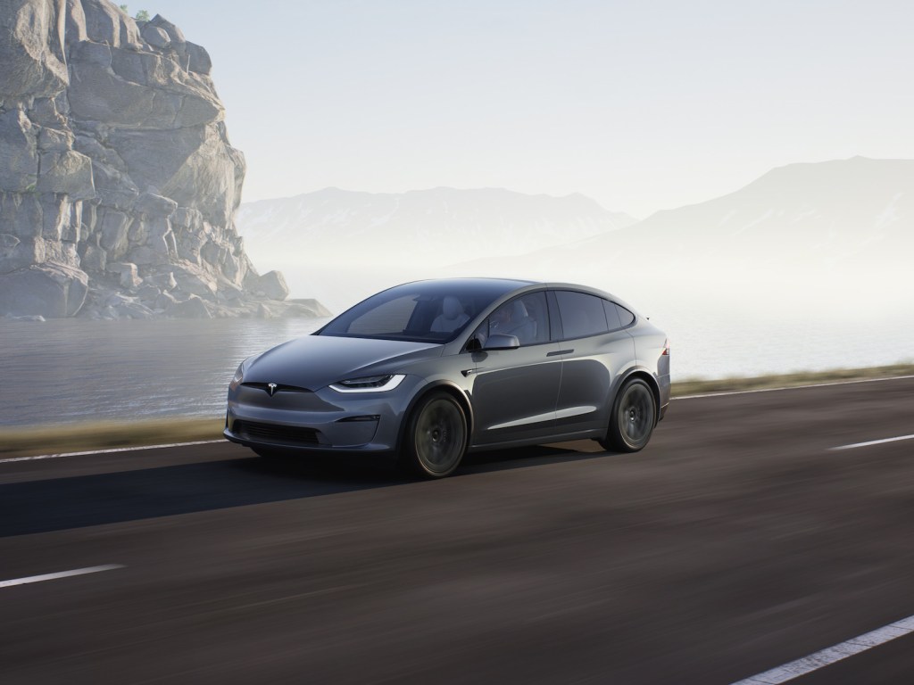 A 2021 Tesla Model X driving through fog, the 2021 Tesla Model X is one of the best AWD electric vehicles