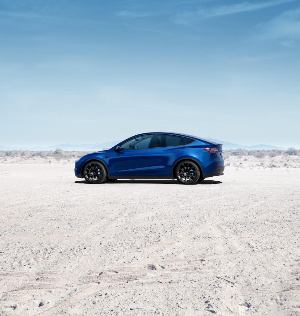 A blue 2021 Tesla Model Y parked in the desert, the 2021 Tesla Model Y is the best AWD electric vehicle